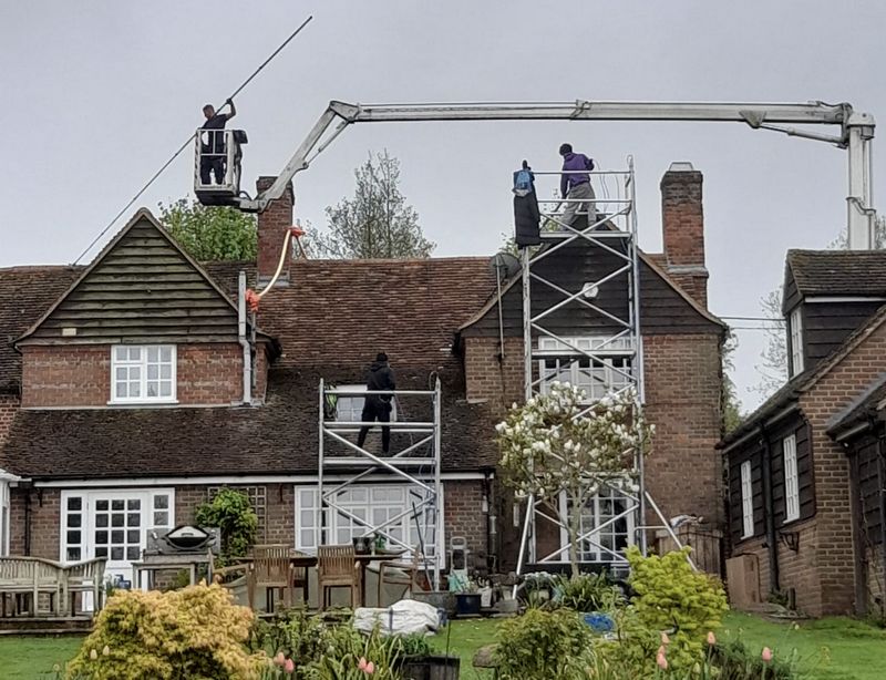 The Roof Moss Cleaners using cherry picker and scaffolding to clean roof safely and professionally in Chorleywood, Hertfordshire