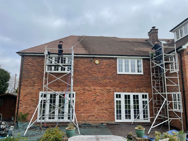 Roof cleaning carried out safely from scaffold towers by The Roof Moss Cleaners in Chorleywood